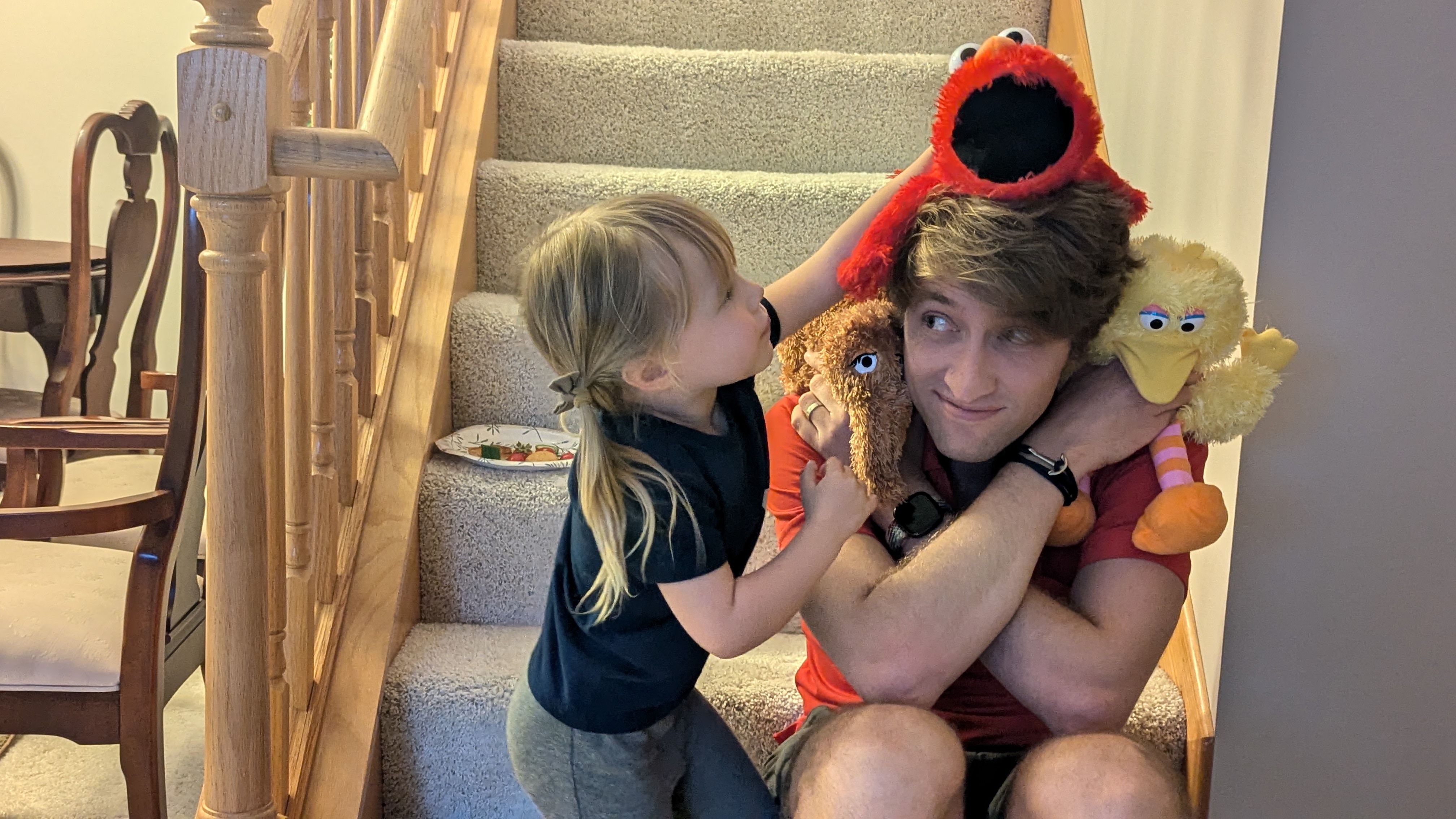 John and daughter playing with puppets