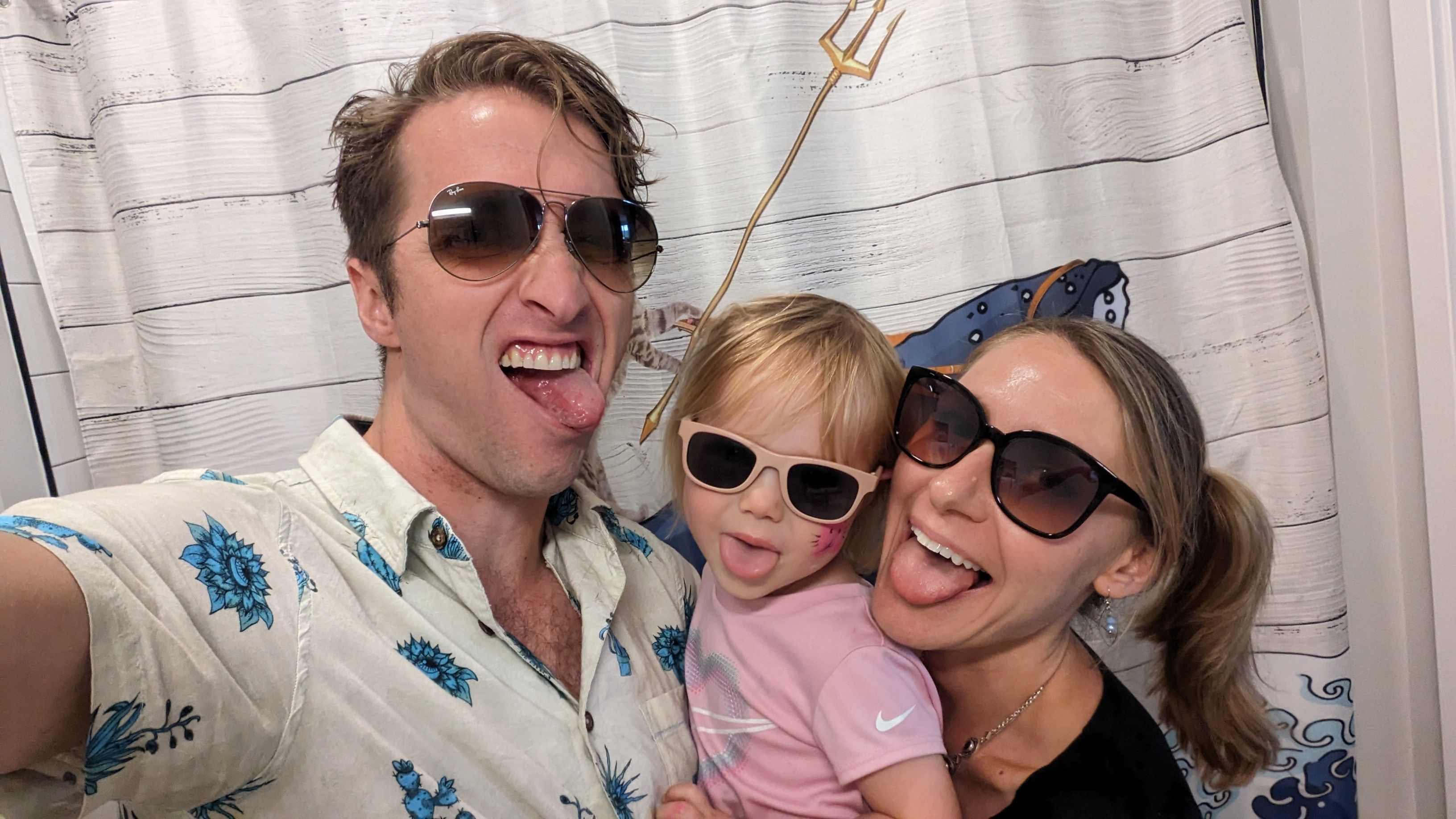 John and family making silly faces with sunglasses